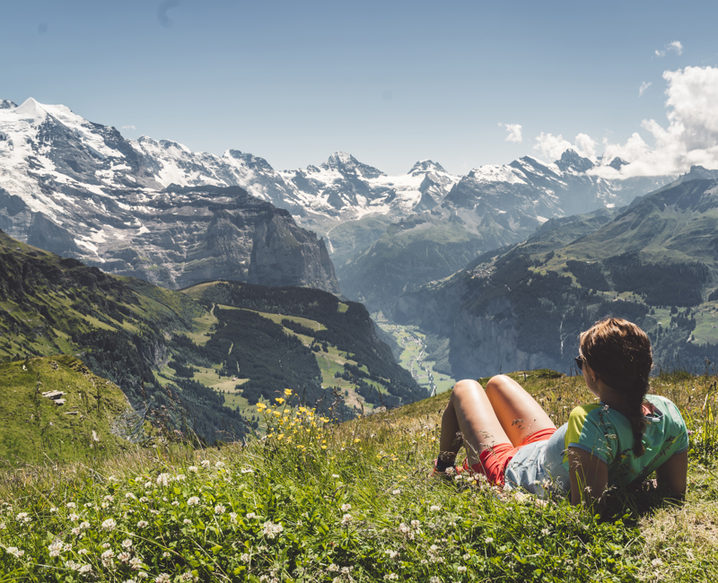 Woman Hiker Enjoying In Panoramic View Of Swiss Alps Stock Photo (1)